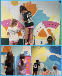 Fifth grade students painting the Nottingham Art Mural