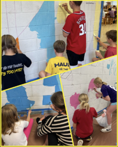 Fifth grade students painting the Nottingham Art Mural