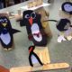 Paper penguins on popsicle sticks